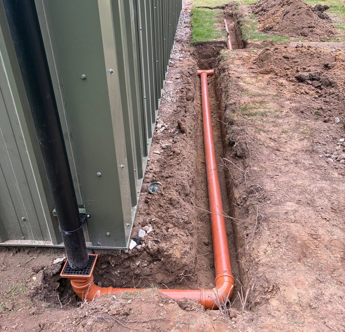 Surface water drainage connected to downpipe, by J.E. Jones, groundworks and earthworks contractors, Lincolnshire