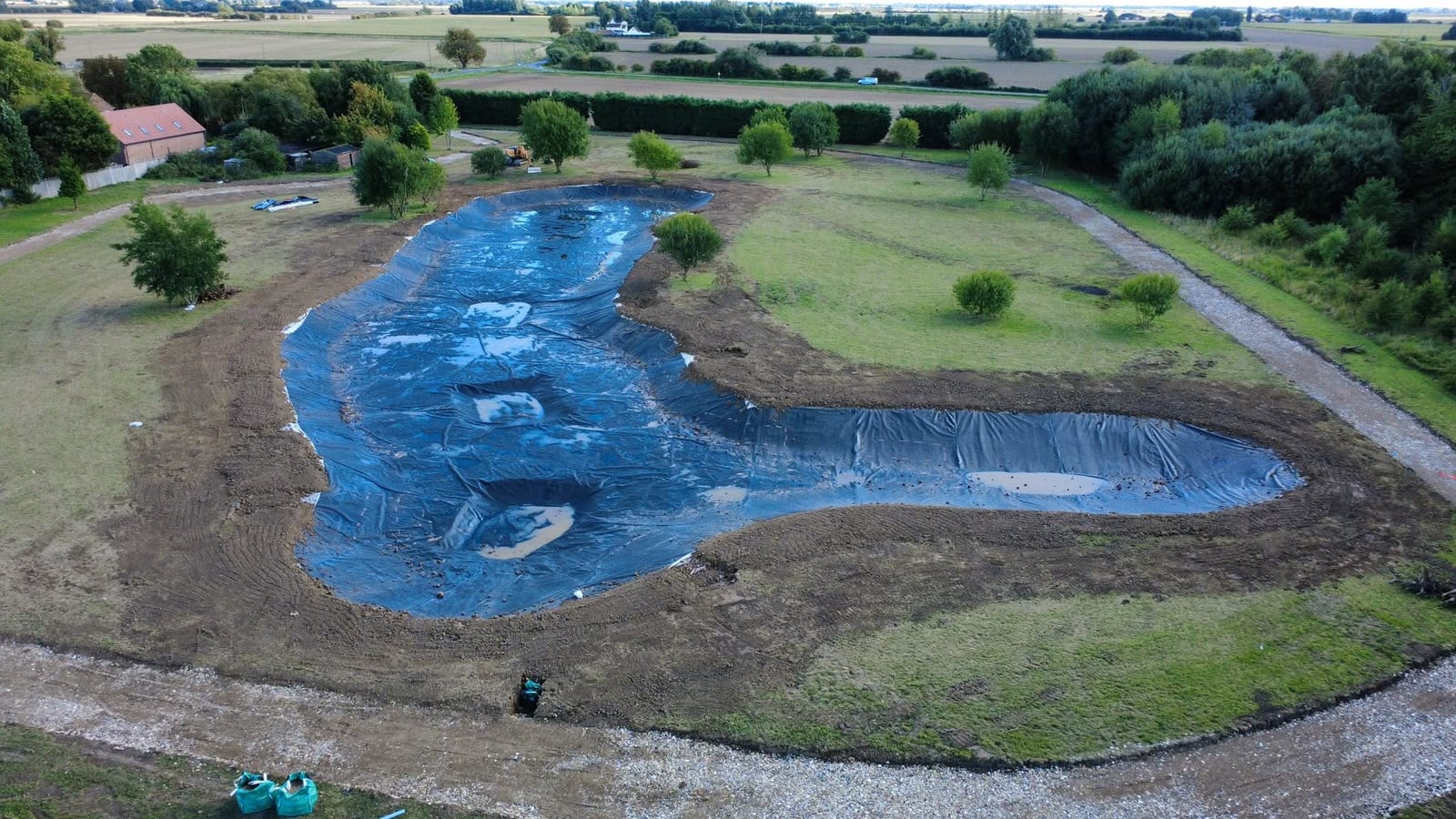 Lined lake filling, Lincolnshire, by J.E. Jones, groundworks and earthworks contractors, Lincolnshire